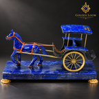 Royal lapis lazuli horse carriage displayed in a navy velvet and brass museum-style cabinet.