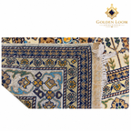 Folded corner revealing the hand-knotted structure and fringe of an Afghan wool carpet