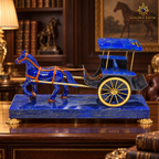 Handcrafted lapis lazuli horse-and-carriage sculpture displayed in a luxury executive office.