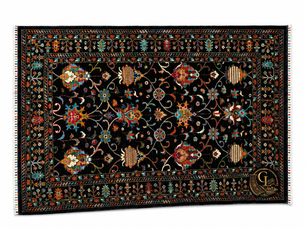 Full flat-lay of the Chobi Sultani Afghan carpet – a breathtaking all-over garden of hand-knotted flowers and vines on a deep black ground, with vibrant multicolor hand-tied fringe that speaks to its artisan origins