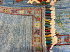 Close-up of the back of a Chobi Sultani hand-knotted Afghan carpet showing tight flat weave structure, colorful hand-tied fringe, and traditional border detail — proof of authentic hand-knotting craftsmanship from Jawzjan, Afghanistan
