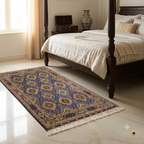 Hand-knotted Afghan carpet on marble bedroom floor, blue and gold traditional medallion rug beside dark wood four-poster bed, Golden Loom Afghanistan