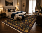 Belzhiki hand-knotted Afghan carpet in a luxury bedroom setting — tile design in burgundy, navy and gold beneath a king bed with dark herringbone wood floor
