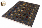Belzhiki & Regional Mirror Design Afghan carpet – 3/4 overhead view on white background showing full dark slate-blue field, symmetrical botanical panel grid with sacred Turkman motifs in burgundy, ivory, gold and navy, arrow and floral border, ivory hand-tied fringe on all four sides, 202×301cm, 100% Turkman wool, Golden Loom Afghanistan