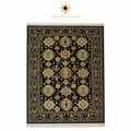 Hand-knotted Afghan Chobi rug with black ground and ivory gold geometric medallion pattern on white background