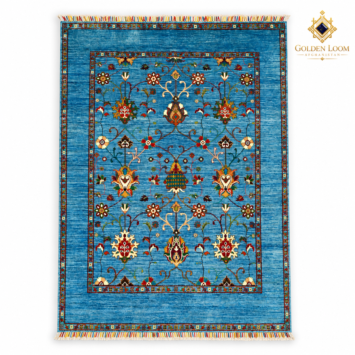Top view of turquoise hand-knotted Afghan wool carpet with botanical motifs, colourful fringes and Golden Loom Afghanistan logo