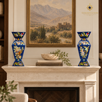 Blue lapis lazuli mosaic vase pair displayed on a limestone fireplace mantel.