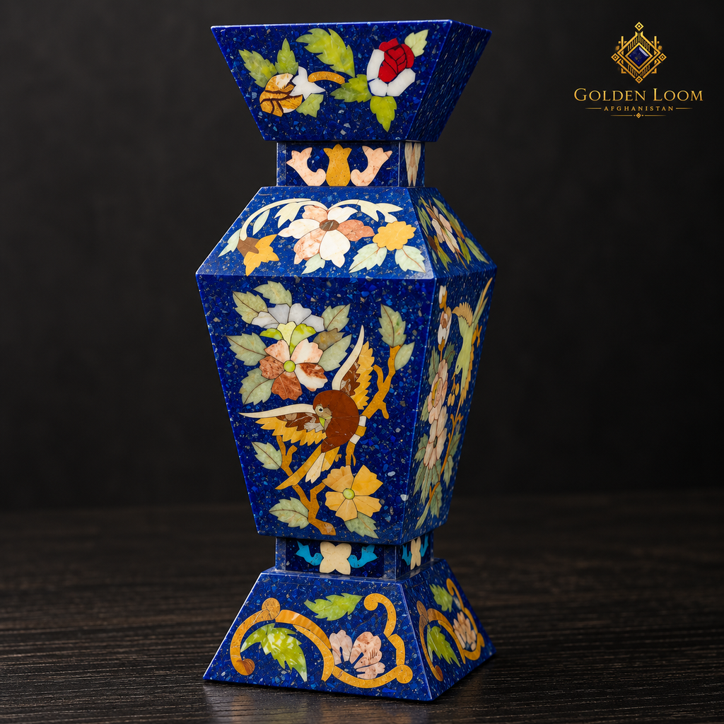 Close-up of handcrafted bird and floral stone inlay on a four-sided lapis lazuli vase.