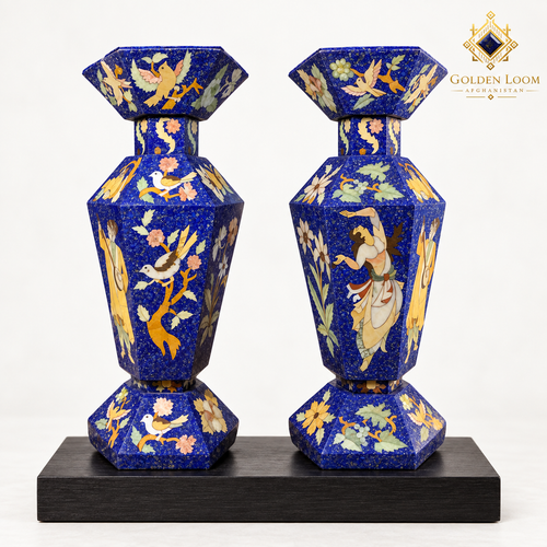 Pair of six-sided Afghan mosaic vases with bird, floral and figurative stone inlay displayed on a black wooden plinth