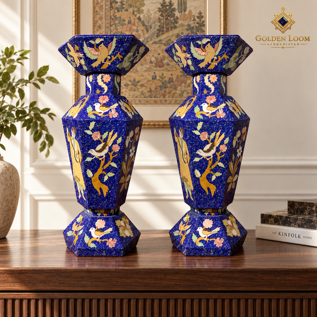 Two six-sided Afghan stone-inlay vases displayed symmetrically on a pale limestone mantel