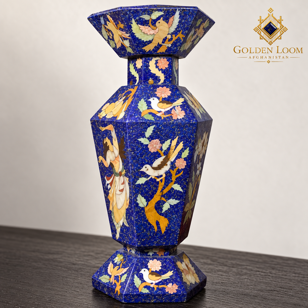 Detailed view of a six-sided mosaic vase highlighting birds, flowering branches, figurative stone inlay and textured lapis chips