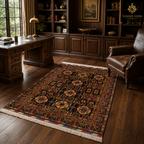 Authentic Afghan hand-knotted carpet with repeating medallion design in deep red and gold beneath a dark wood dining table — Golden Loom Afghanistan