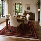 Mawr Heritage hand-knotted Belzhiki Afghan wool rug beneath a wooden dining table in an elegant dining room
