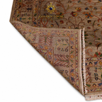 A close-up of a traditional patterned area rug with a folded corner showing the underside and fringe, on a white background. The brand logo 'GOLDEN LOOM' is visible near the top.