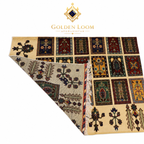 An Afghanistani area rug with a multicolor geometric and floral pattern, shown partially folded to display both its front and back. The brand logo 'Golden Loom Afghanistan' is visible at the top of the image.