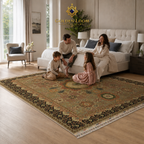 Hand-knotted Afghan carpet with sage green Mamluk medallion design and black border with family sitting on rug in a modern Scandinavian-style bedroom — Golden Loom Afghanistan