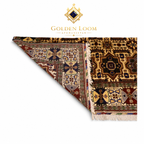 Close-up of hand-knotted Afghan rug corner folded back to reveal dense wool pile and intricate geometric border pattern in ivory, navy, burgundy, and gold — Golden Loom Afghanistan