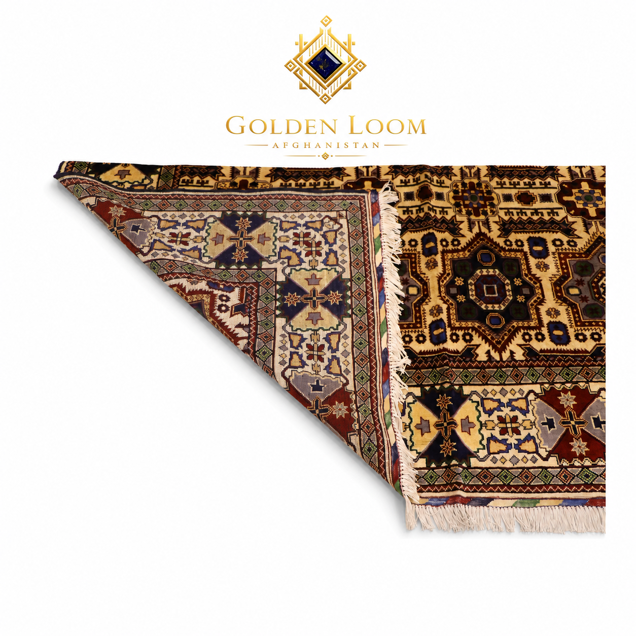 Close-up of hand-knotted Afghan rug corner folded back to reveal dense wool pile and intricate geometric border pattern in ivory, navy, burgundy, and gold — Golden Loom Afghanistan