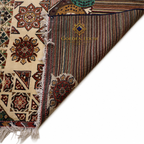 Close-up of handwoven Afghan rug showing front geometric floral pattern in ivory and brown alongside reverse side revealing multicolor striped flatweave construction and hand-knotted fringe detail