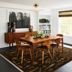 Golden Loom Afghanistan handwoven wool rug anchoring formal dining room with dark walnut table, crystal chandelier, and landscape oil painting