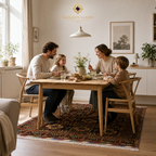 Handwoven Afghan carpet under a family dining table in a bright Scandinavian-style home, Golden Loom Afghanistan