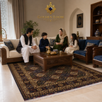 Handwoven Afghan carpet with navy and ivory geometric floral pattern in a traditional South Asian family sitting room