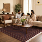 Afghan family seated on a cream sofa over a deep burgundy hand-knotted wool carpet with all-over diamond lattice pattern in a warm natural light living room — Golden Loom Afghanistan