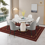 Traditional Afghan wool carpet in deep red with all-over geometric pattern styled under a modern round dining table — Golden Loom Afghanistan
