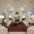 Hand-knotted Afghan carpet in deep crimson with all-over geometric lattice pattern styled in a bright formal living room with vaulted ceiling and gold mirror accents — Golden Loom Afghanistan