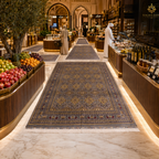 Hand-knotted Afghan runner carpet displayed in a luxury Gulf market corridor with marble floors and warm ambient lighting