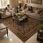 Hand-knotted Afghan area rug with repeating geometric medallions in charcoal and gold styled in a warm family living room with a South Asian family seated on beige sofas — Golden Loom Afghanistan