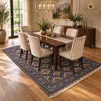 Blue hand-knotted Afghan wool carpet placed beneath a wooden dining table in a refined dining room.