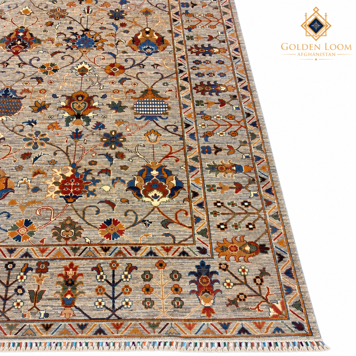 Close-up of the carpet’s beige field, colourful botanical motifs and detailed woven border
