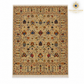 Beige Afghan carpet with multicoloured botanical motifs and fringed ends on a white background