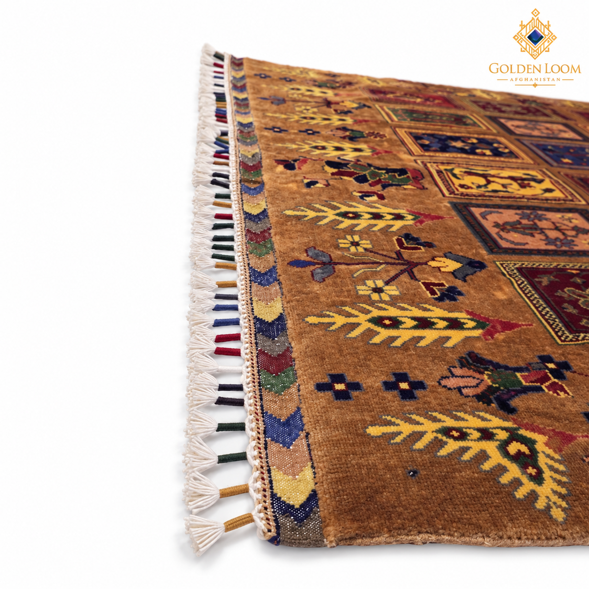 A close-up of a traditional handwoven rug with a warm brown base, featuring geometric and floral motifs in yellow, blue, red, and green, finished with white tassels on a white background.