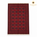 Top view of a red Khal Mohammadi hand-knotted Afghan wool carpet with dark geometric motifs and white fringe.