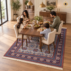 Family dining room styled with a blue-grey hand-knotted Afghan wool carpet featuring navy and rust geometric motifs.