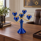 Five-light Afghan lapis lazuli and brass candelabrum displayed on a wooden table in an elegant collector’s library.