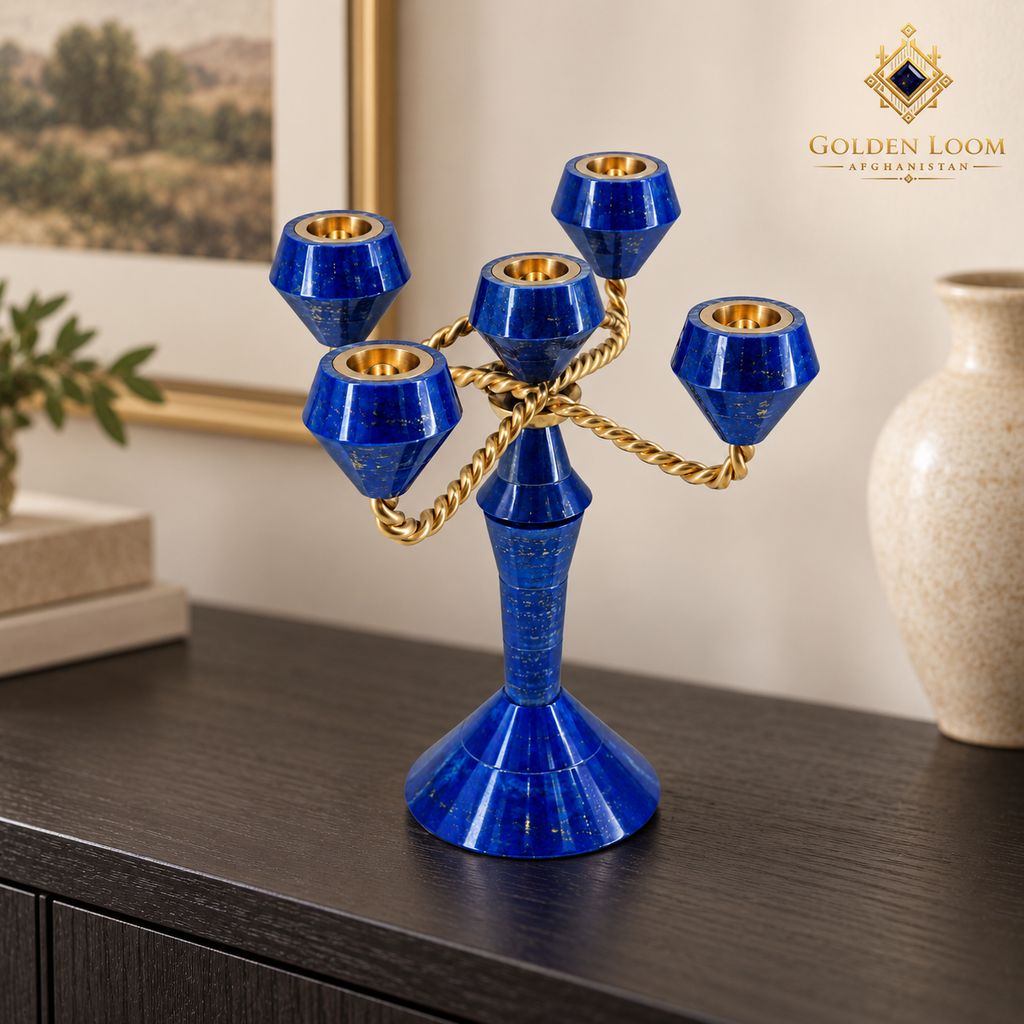 Blue lapis lazuli five-light candelabrum with twisted brass arms displayed on a dark-wood console.