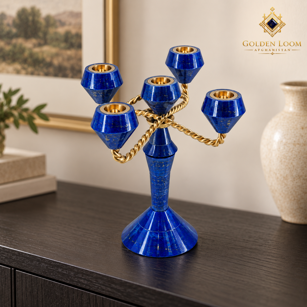 Blue lapis lazuli five-light candelabrum with twisted brass arms displayed on a dark-wood console.