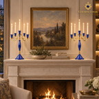 Matching five-arm lapis lazuli candelabra displayed symmetrically on a formal stone fireplace mantel.