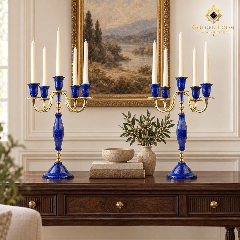 Pair of five-arm lapis lazuli candelabra arranged around flowers on an elegant dining table.