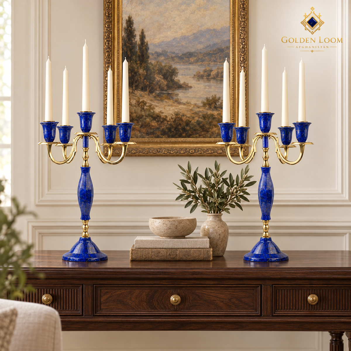 Pair of five-arm lapis lazuli candelabra arranged around flowers on an elegant dining table.