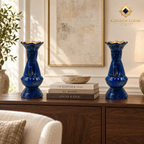 Handcrafted lapis lazuli vase pair styled with dried ivory botanicals and eucalyptus on a walnut dining table.