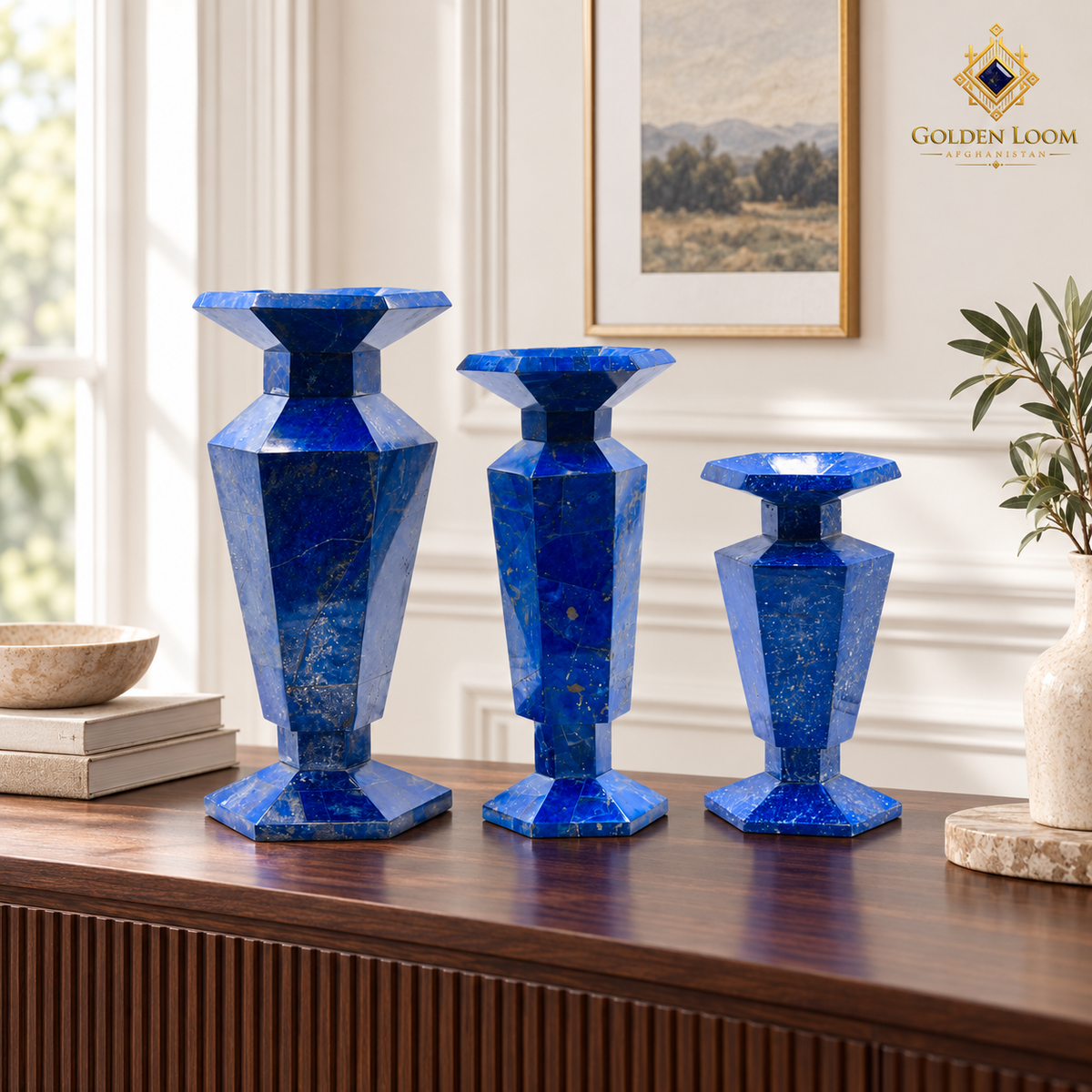 Elevated three-quarter view of three handcrafted lapis lazuli vases in graduated heights.