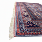 Ivory fringe detail of hand-knotted Afghan Bokhara wool rug from Qarqin, Jawzjan, Afghanistan