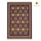 Top view of a multi-colour hand-knotted Afghan wool carpet with diamond motifs and fringed ends on a white background.