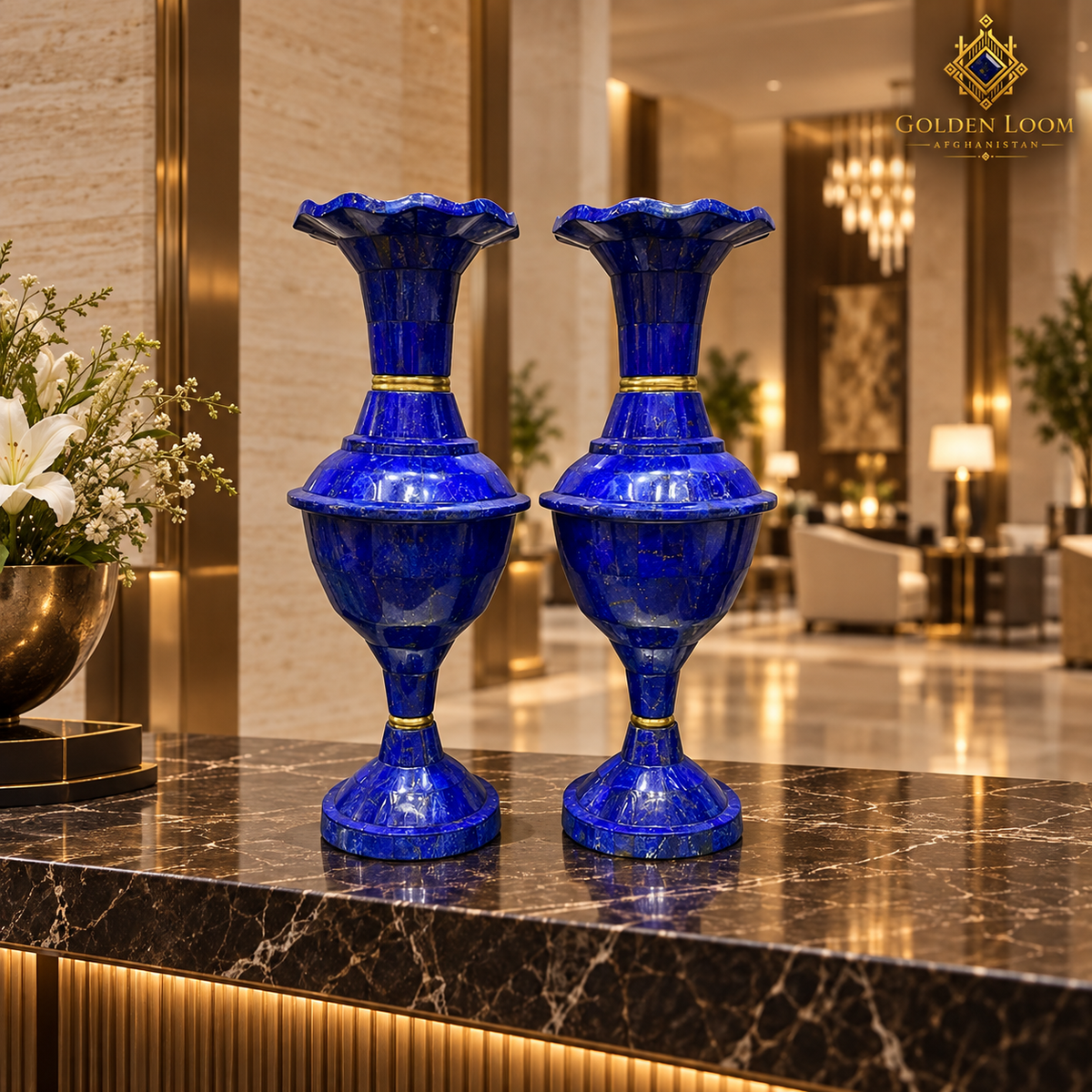 Lapis lazuli vase pair displayed on a dark marble console in a luxury hotel lobby.