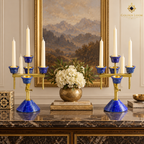 Pair of handcrafted lapis lazuli and brass five-light candelabra displayed symmetrically on an elegant dining table.
