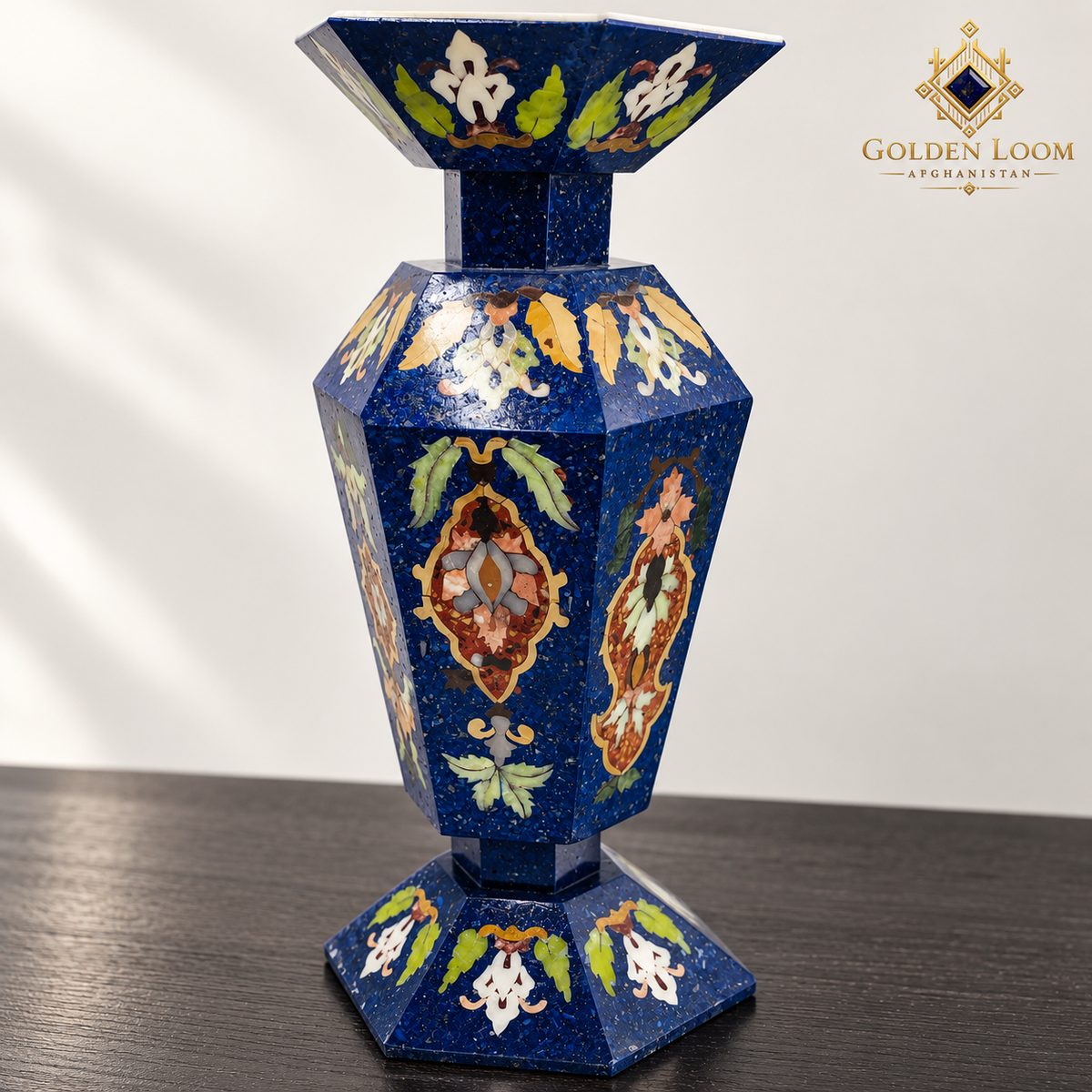 Detailed view of a six-sided mosaic vase highlighting colorful floral stone inlay, faceted construction and textured lapis lazuli chips